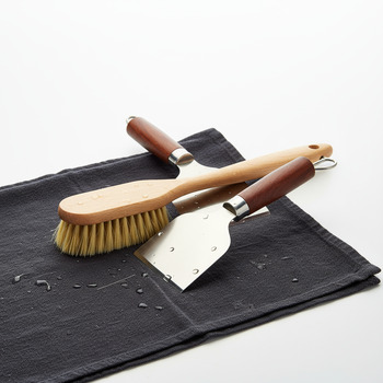 Brush and scraper set on a dark cloth