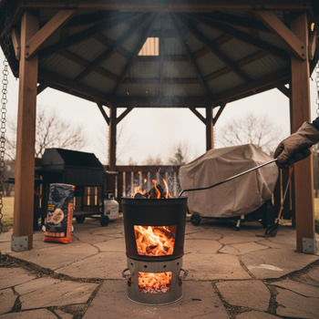 Chimney starter lit under a covered area