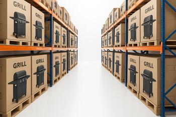 Warehouse aisle with pallets of boxed grills